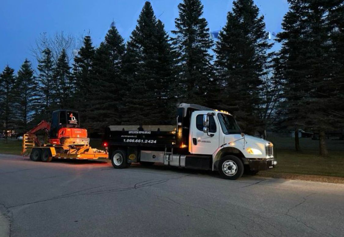 Plumbing Medic truck and excavator ready for sewer and septic work in Oro-Medonte