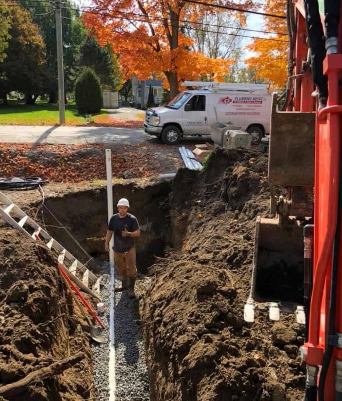 Plumbing Medic technician installing underground pipe in Oro-Medonte